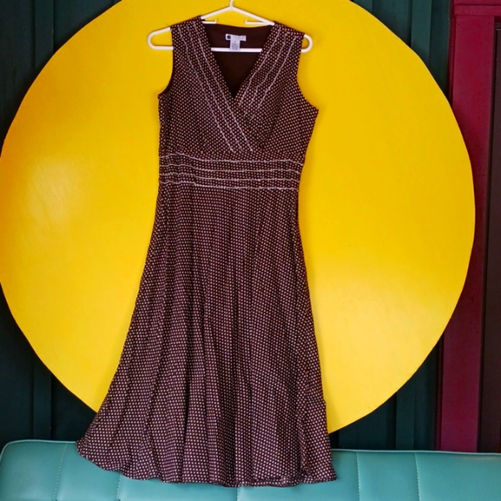Carole little. Brown and white polka dot dress.
